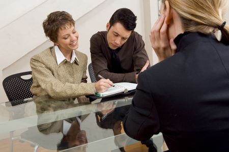 Team planning a time with woman looking on.