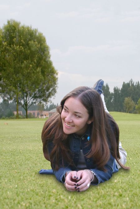 casual girl lying on the grass