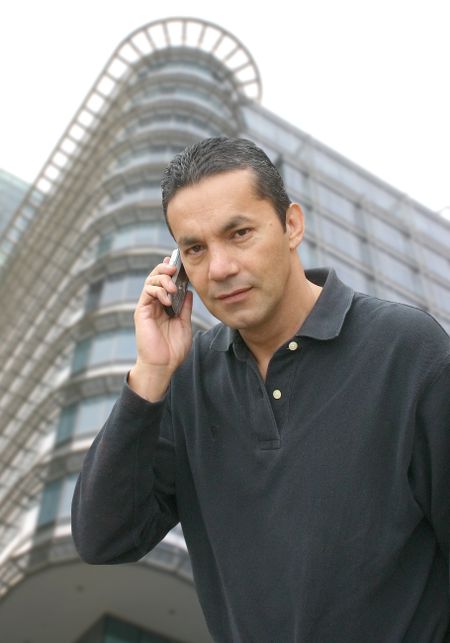 casual man talking on the phone in a financial centre