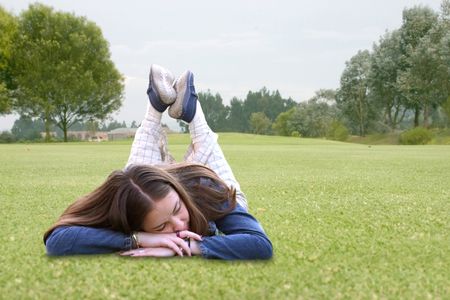 casual girl sleeping on the grass