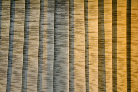Interior view of venetian blinds closed near sunset