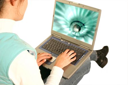 girl using a laptop to send an email