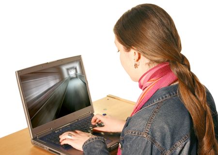 girl using laptop on a desk