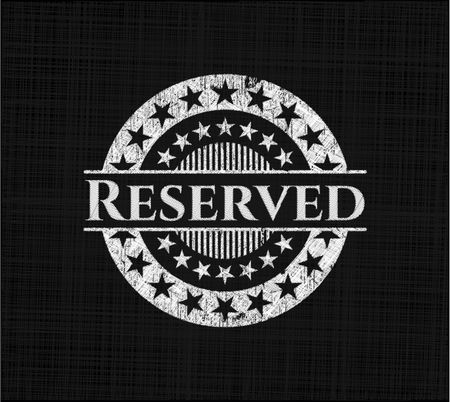 Reserved chalk emblem written on a blackboard