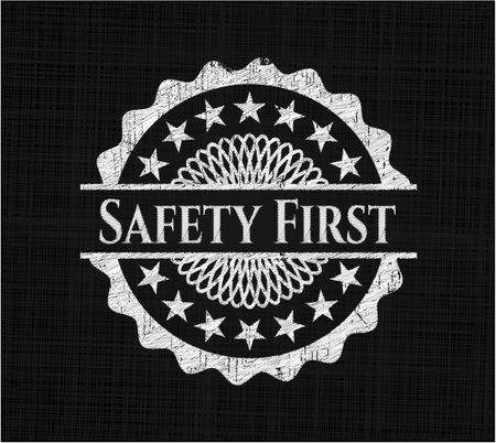 Safety First chalkboard emblem written on a blackboard