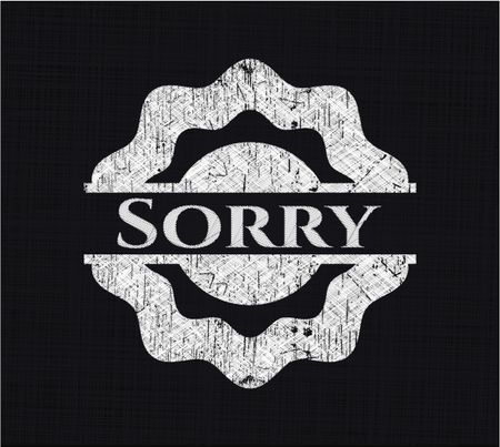 Sorry chalk emblem written on a blackboard