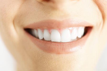 Detail of a woman smile showing white clean teeth