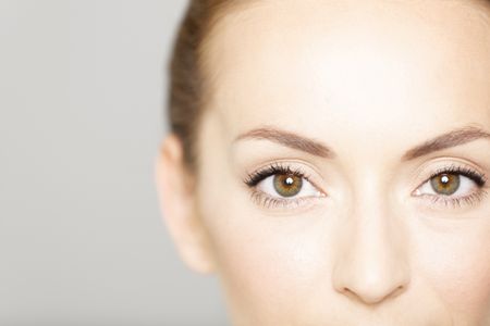 Cropped around the eyes of a young female in a beauty style pose