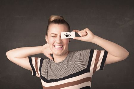 Silly youngster looking with hand drawn eye paper concept