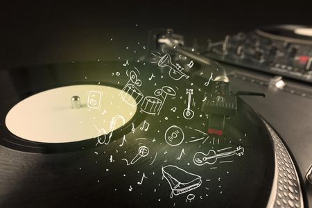 Turntable playing classical music with icon drawn instruments concept on background