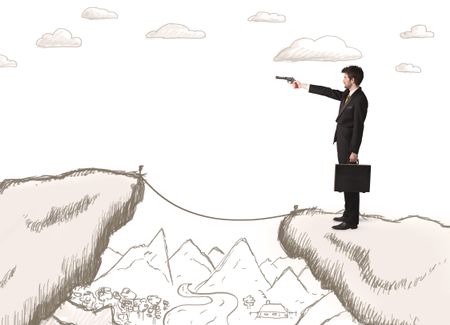 Businessman standing on the hand drawn edge of mountain