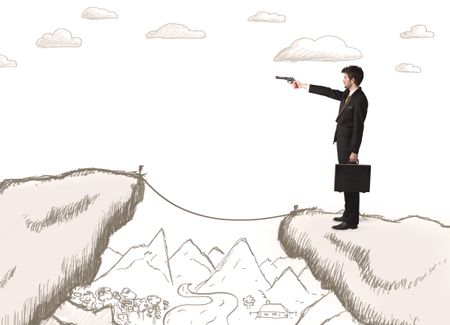 Businessman standing on the hand drawn edge of mountain 