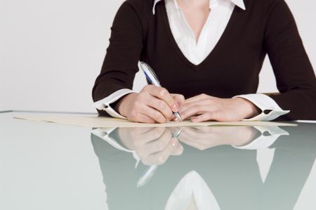 Close up of a businesswoman writing.