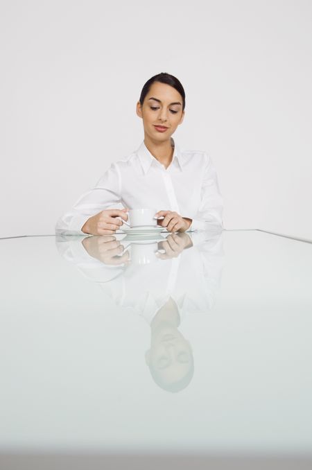 Looking in a cup of coffee.