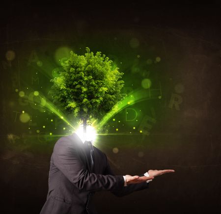 Man with green tree head concept on brown background