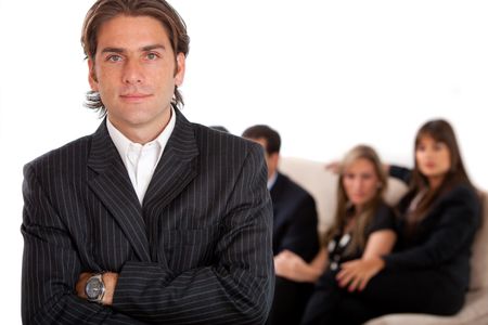 Business man with his team behind him isolated on white