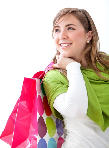 Casual woman with shopping bags isolated on white