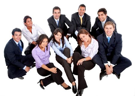 Business group sitting on the floor isolated over white