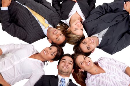 business teamwork with heads together on the floor isolated
