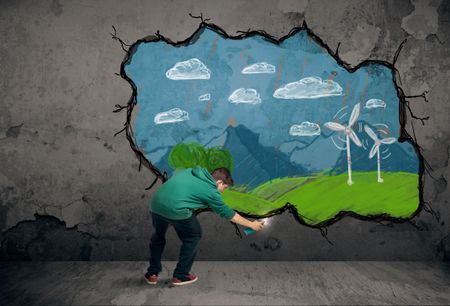 Young urban painter drawing colorful future image on the wall