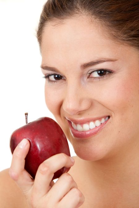 casual woman with an apple over a white background