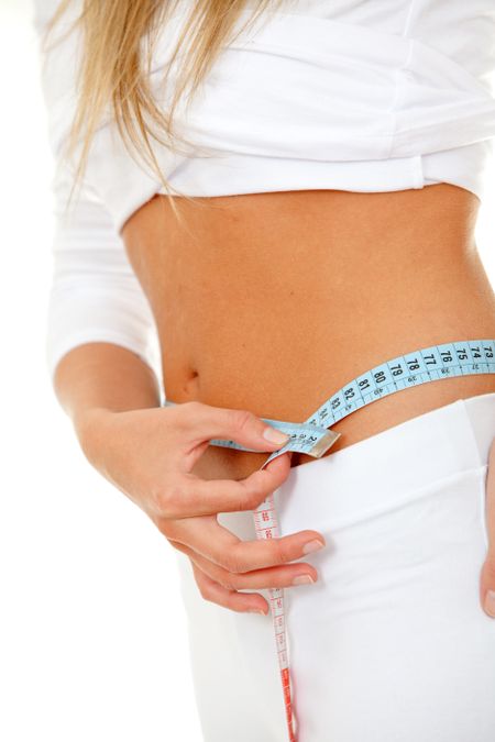 fit female measuring her waist - weight loss series