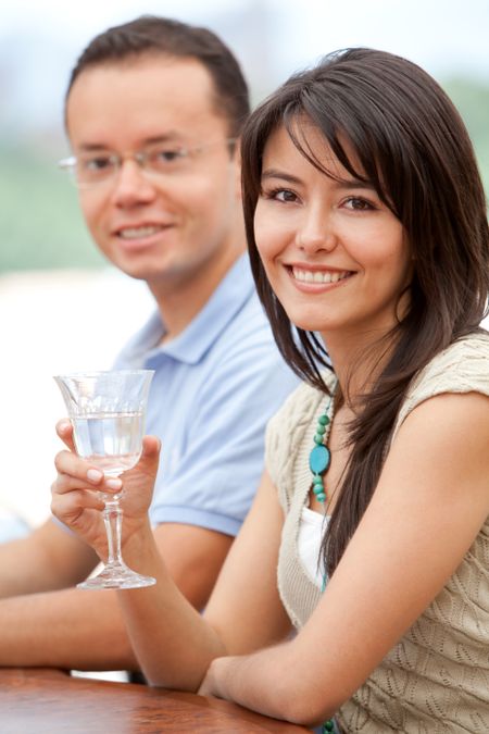 Beautiful couple having a drink at a bar