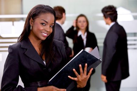 Beautiful business woman holding a portfolio