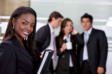 Portrait of a business woman in an office smiling