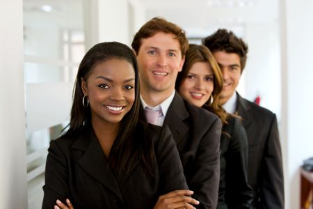 Small business team in an office smiling