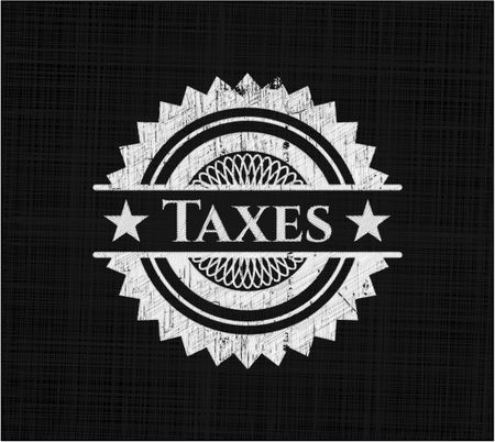 Taxes chalkboard emblem on black board