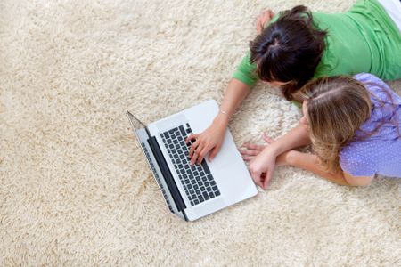 Couple of girls working on a laptop computer