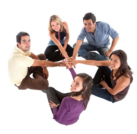 Happy group of friends with their hands together in the middle, isolated