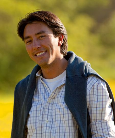 handsome casual male portrait outdoors smiling