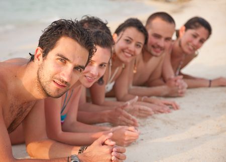 group-friends-lying-beach-31635064 Group of friends lying on the beach