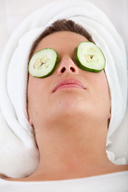 Woman enjoying her facial treatment - beauty concepts