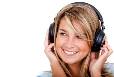Girl with headphones listening to music isolated