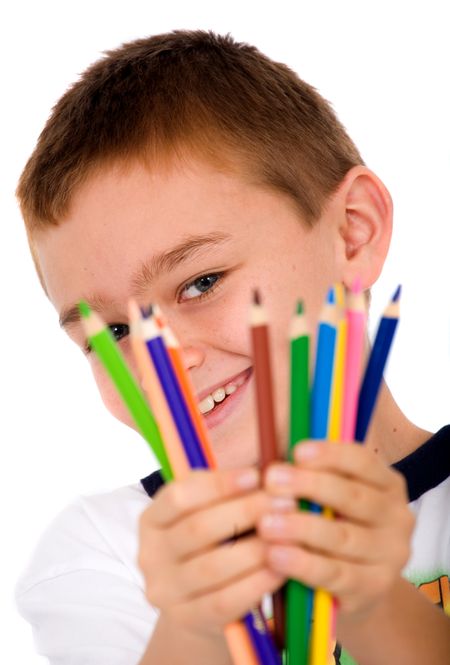 happy boy with color pencils over a white background