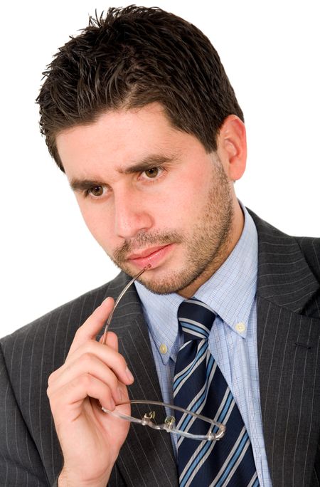 pensive business man wearing glasses over a white background