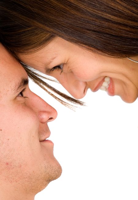 happy couple with heads together over a white background