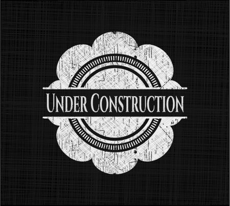 Under Construction chalk emblem written on a blackboard