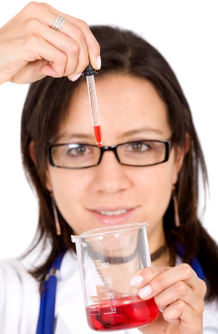 beautiful female young scientist wearing glasses while doing a blood test