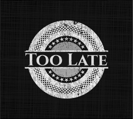 Too Late written on a blackboard