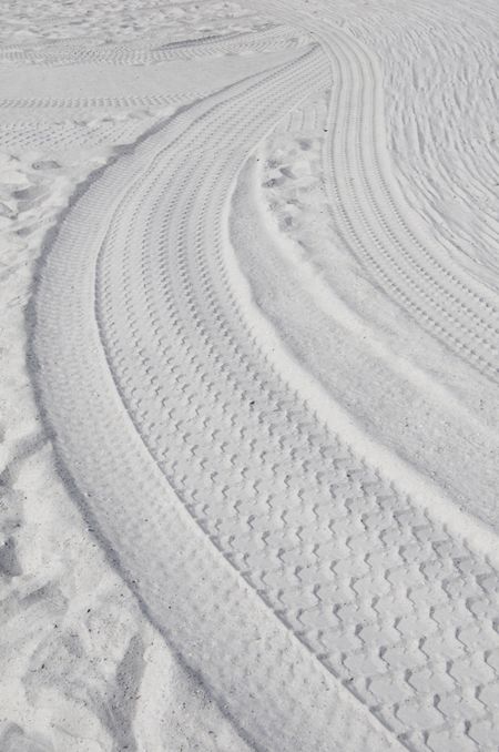 Tire tracks in white sand, Clearwater Beach, Florida