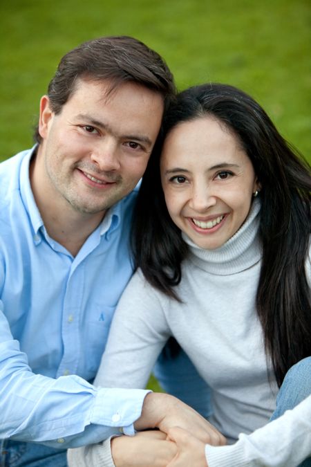 loving couple portrait looking happy and smiling outdoors