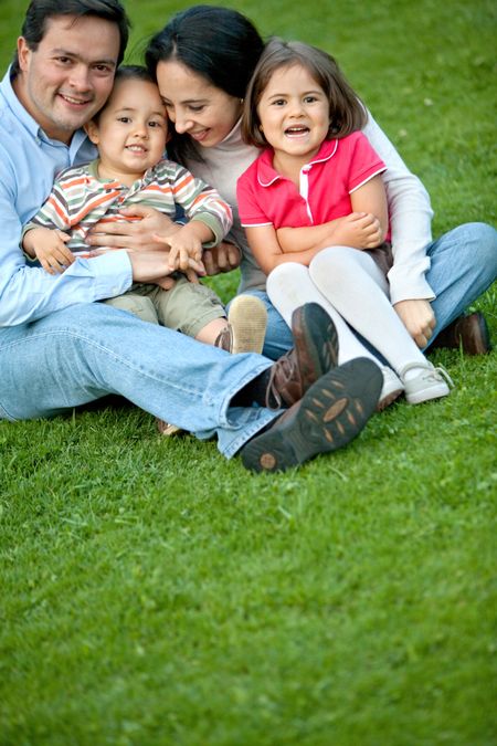 Beautiful family portrait smiling and having fun outdoors