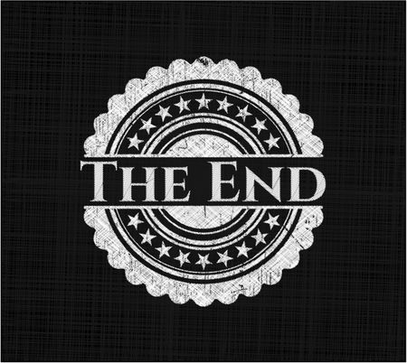The End chalkboard emblem on black board