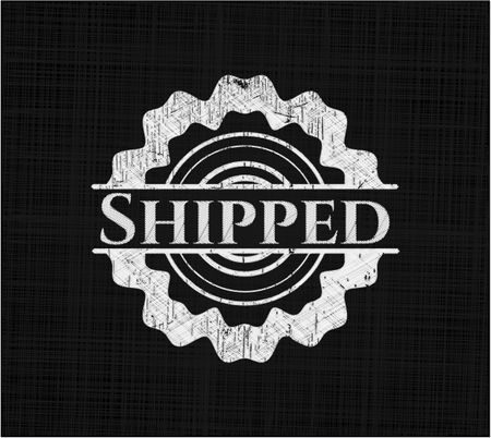 Shipped chalk emblem written on a blackboard