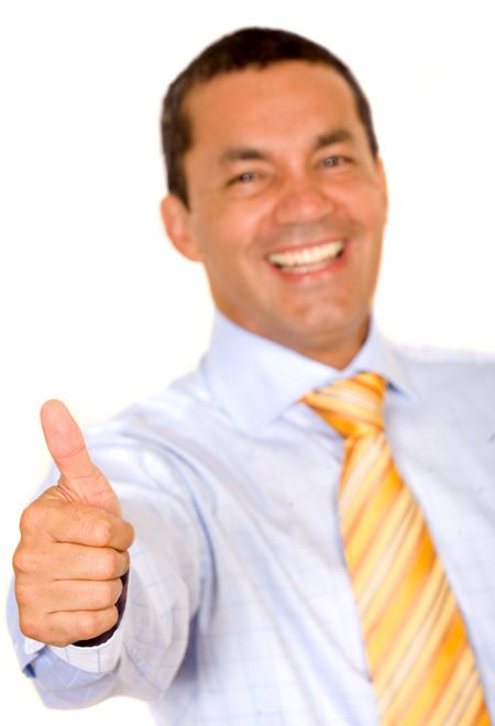 successful business man with thumbs up over a white background - focus is on hand