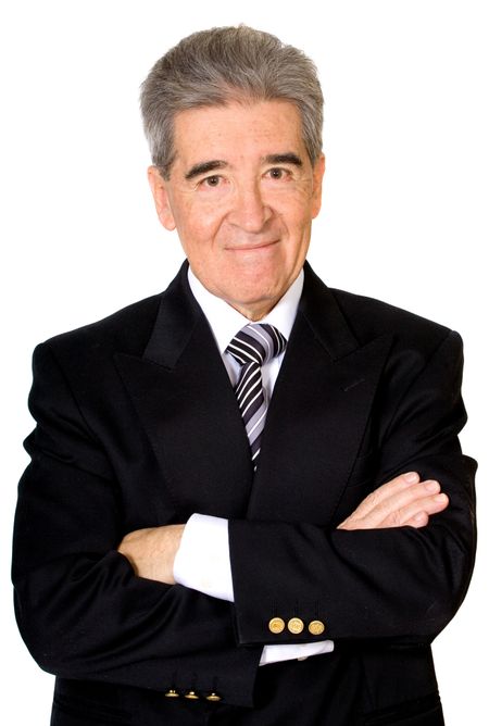 Business man smiling with arms crossed over a white background